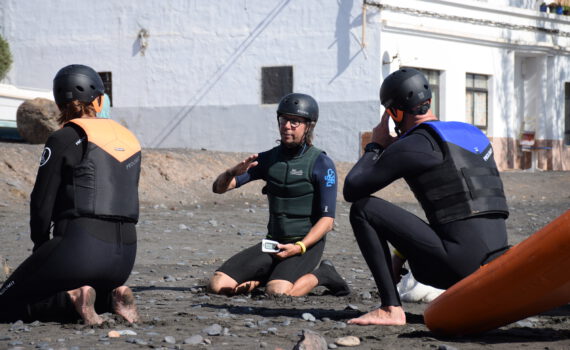 instructor explains theory on the beach